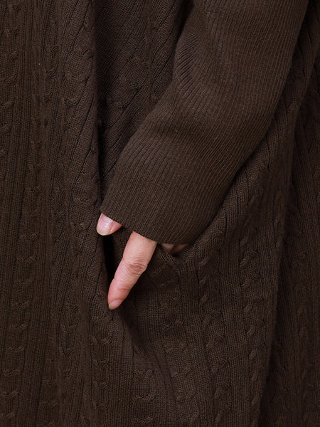 秋の女性のルーズ長袖コート